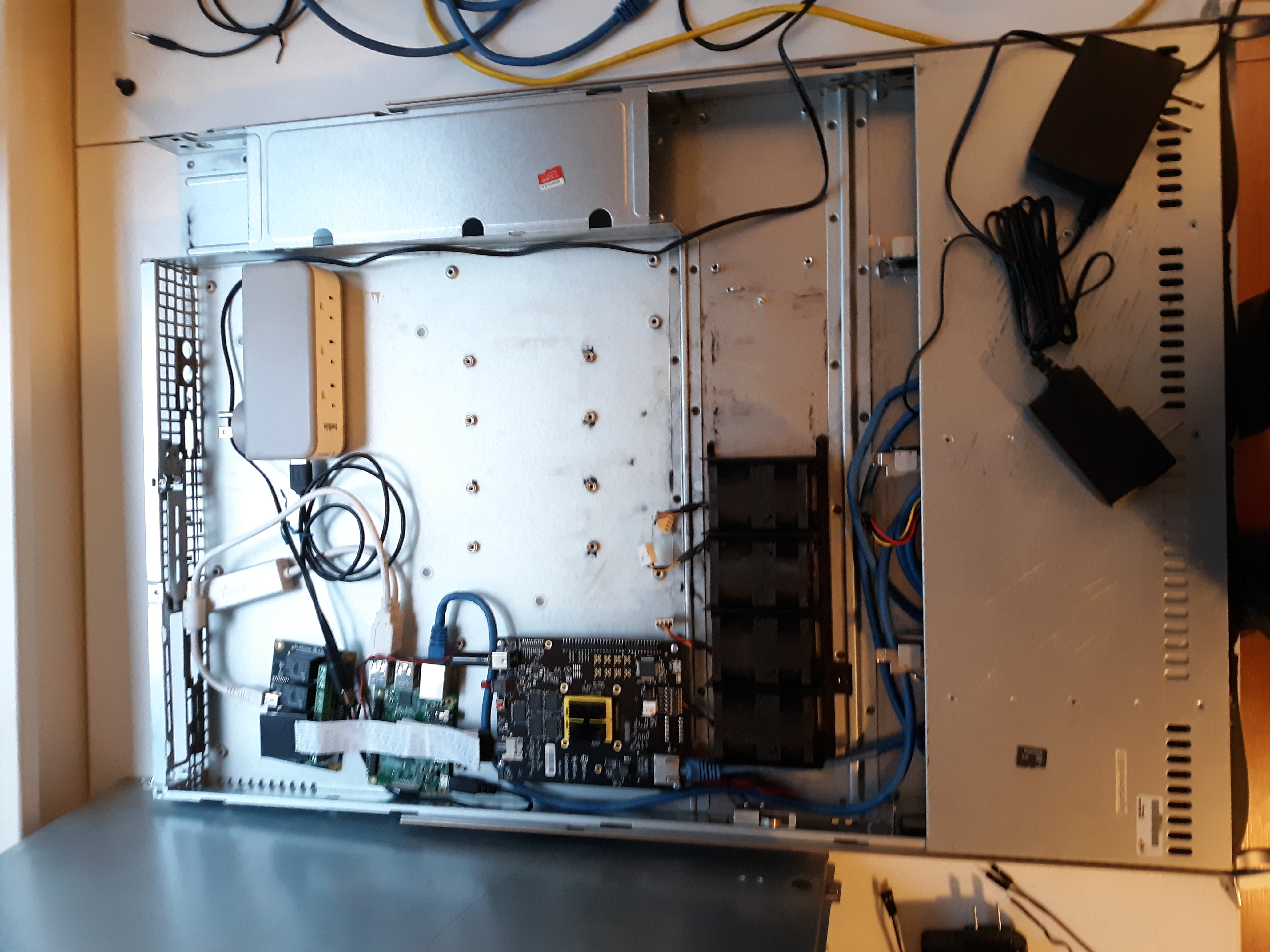 Picture of a 1U chassis with a bunch of custom components within